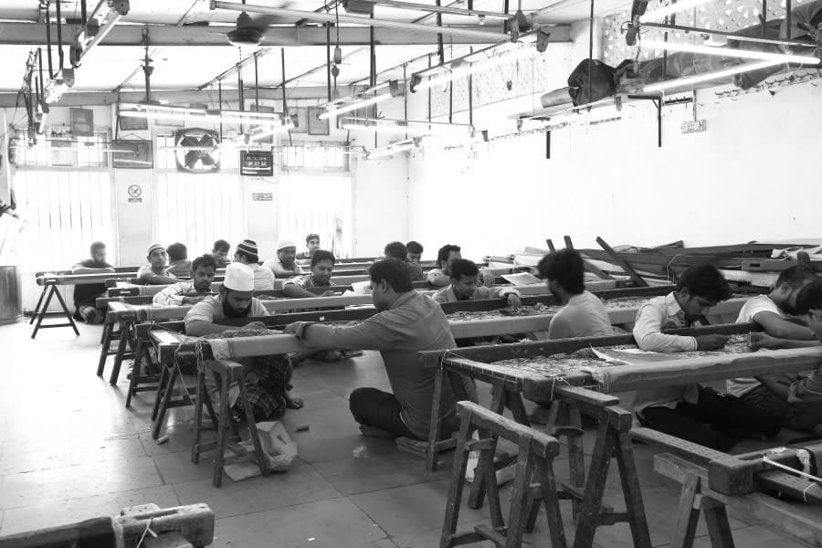 Artisans working on intricate embroidery at Babar Gee Fashion